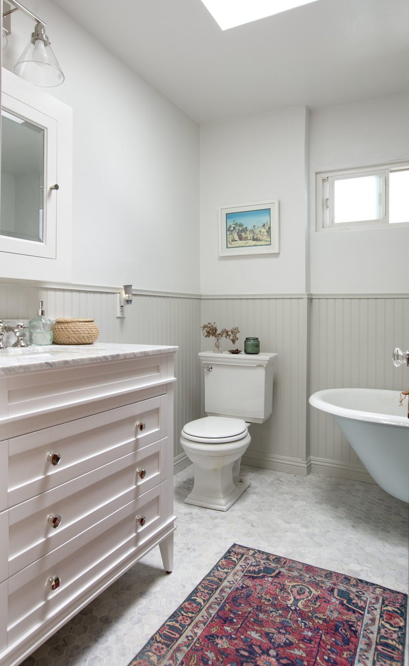 Gray and White marble bathroom with beadboard